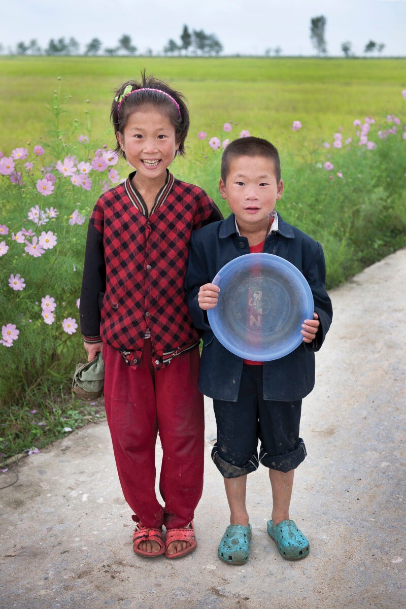 Two children at a communal farm in Kangwon Province, North Korea | Mark Edward Harris