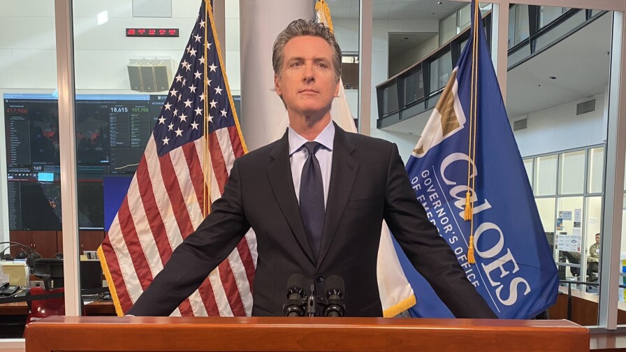 Governor Gavin Newsom in front of the governor seal at podium