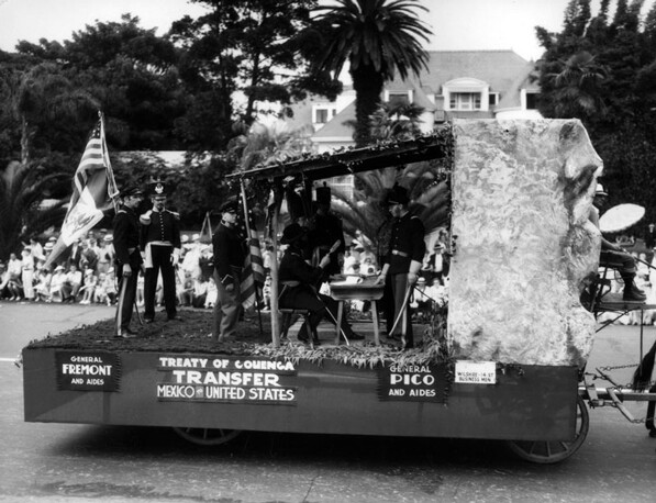 A re-enactment of the signing of the Capitulation of Cahuenga on a parade float. Courtesy of the Los Angeles Public Library Photograph Collection.