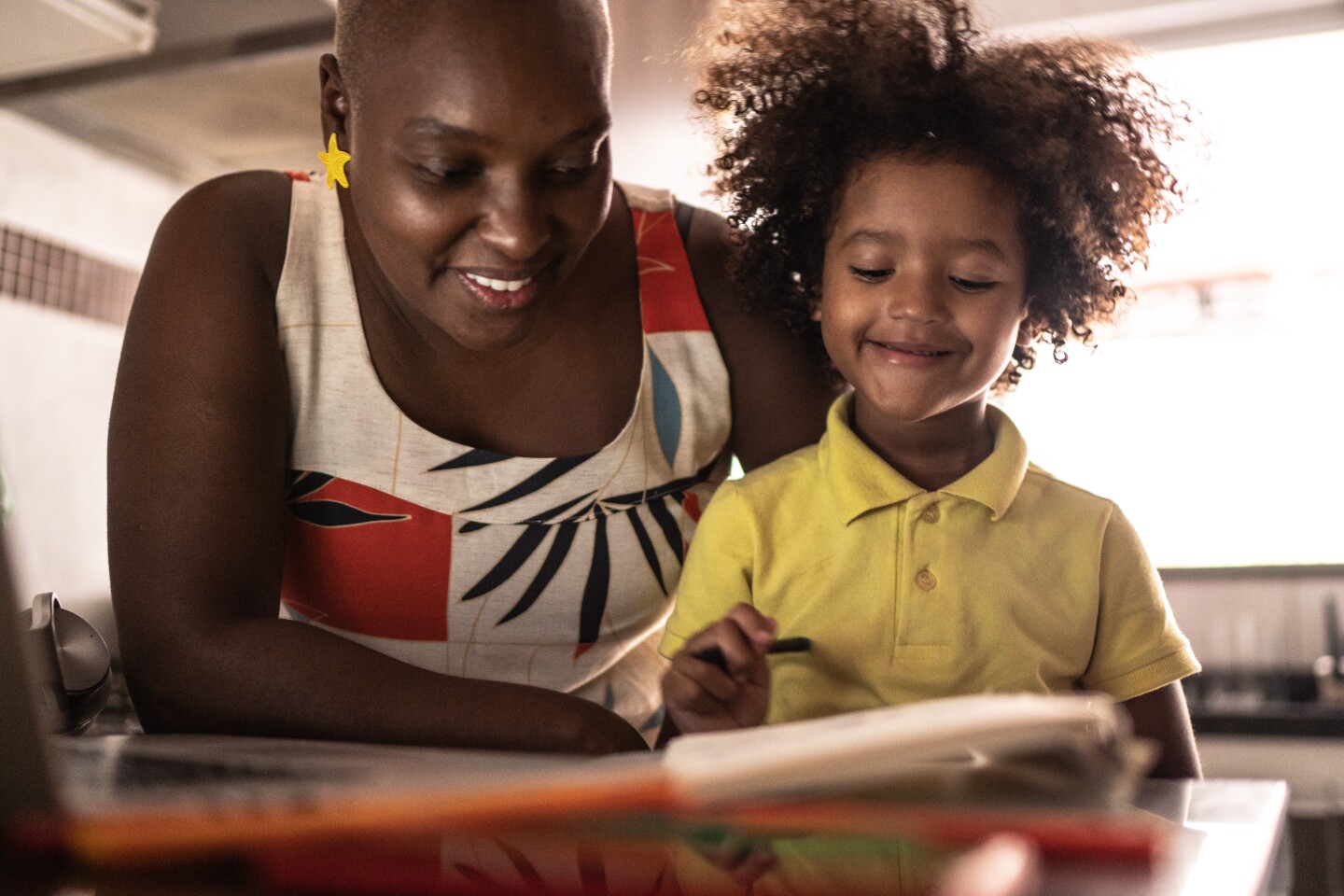 A mother and child read together