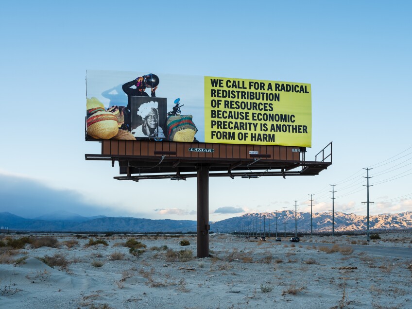 Another one of Simmons' billboards features a portrait of Marsha P. Johnson, a Black, trans-rights activist and prominent figure in the Stonewall uprising of 1969. It also reads, "We call for radical distribution of resources because economic precarity is another form of harm."