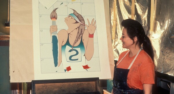 Barbara Carrasco standing next to her print 'Self-Portrait' made in 1984