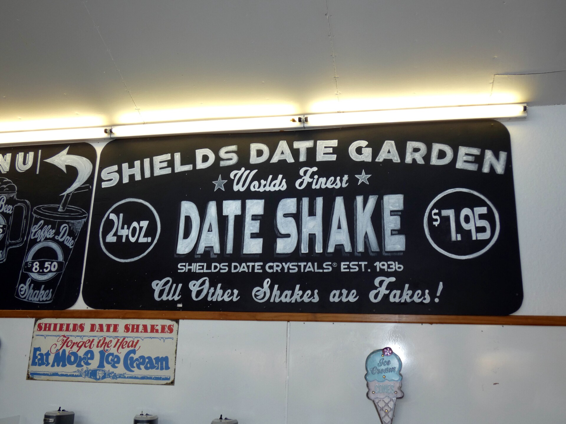 A sign that reads, "Shields Date Garden, world's finest Date Shake."