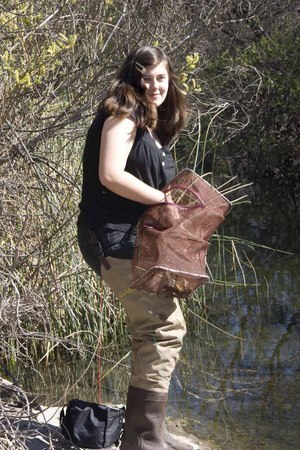 Madeleine Cray, a volunteer with Heal the Bay's Stream Team trapping invasive crayfish | Photo by Carren Jao