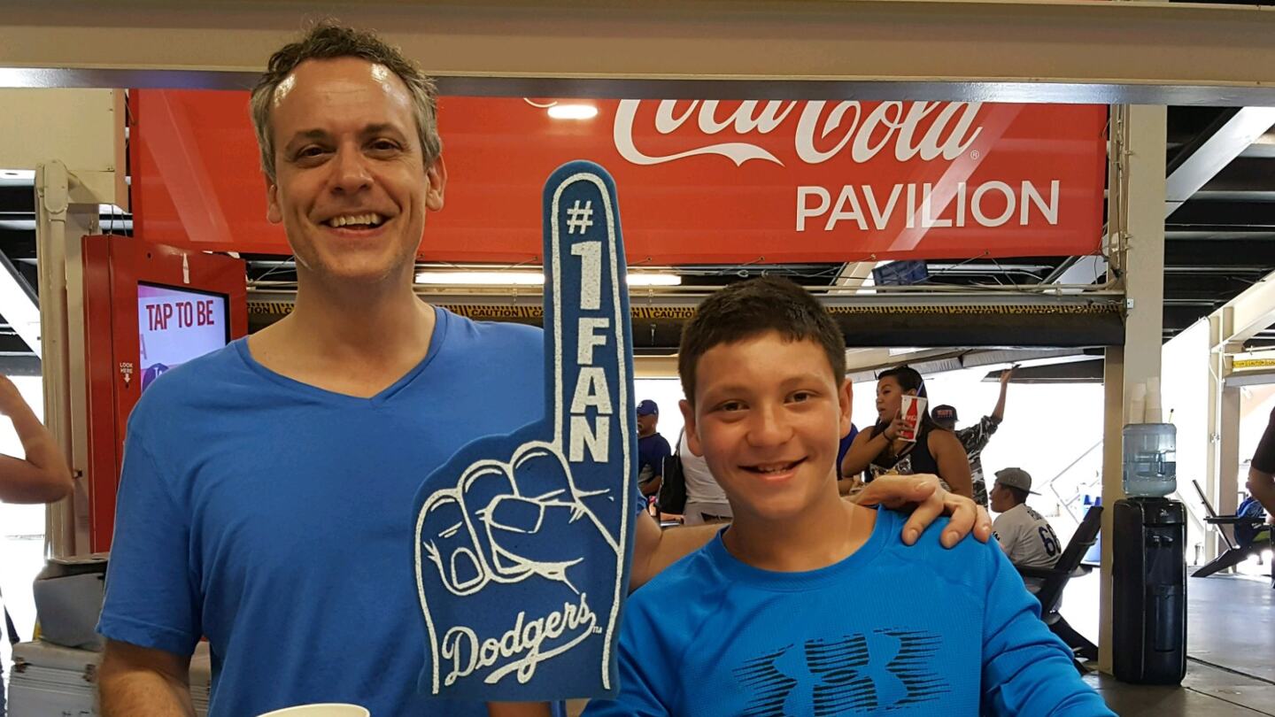 Pete Gragnani and a foster youth at a Dodger Game