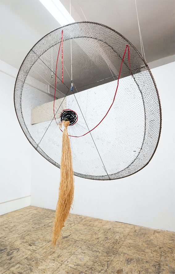 Milk, 2018 Form the Cosmotarrayas Series Tar dipped artisanal fishing net, lead weights, carabineer, metal ring, paracord, ribbon, raffia 96 x 96 x 35 inches Courtesy of the artist and Instituto de Visión.png