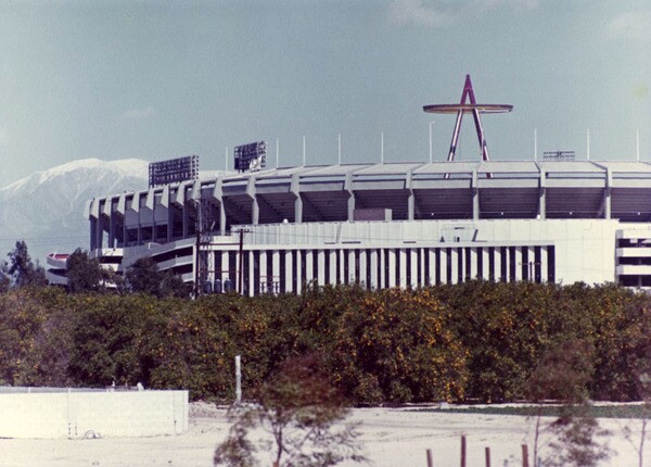 Mount Baldy and an orange grove frame this Big A and Anaheim Stadium in this undated photograph. Courtesy of the Security Pacific National Bank Collection, Los Angeles Public Library.