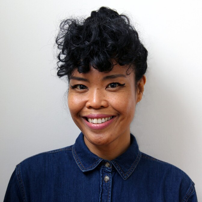 headshot of a woman smiling at the camera
