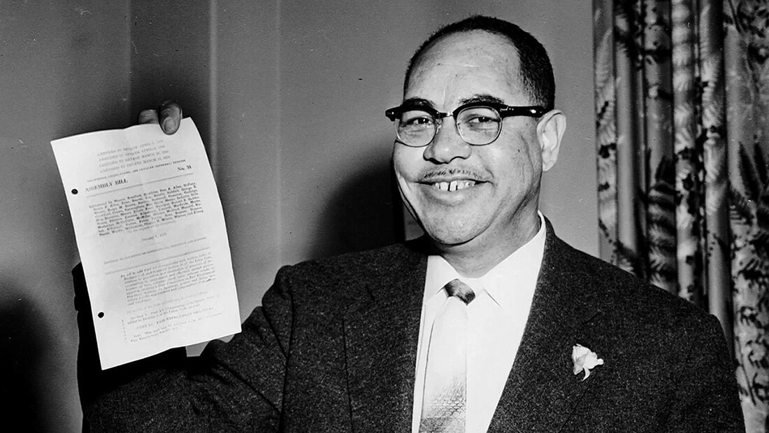 Byron Rumford holding up a document. | Fair Legislation - The Byron Rumford Story