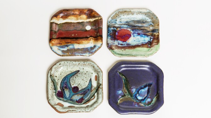 A selection of octogonal ceramic plates with an impressionistic design.