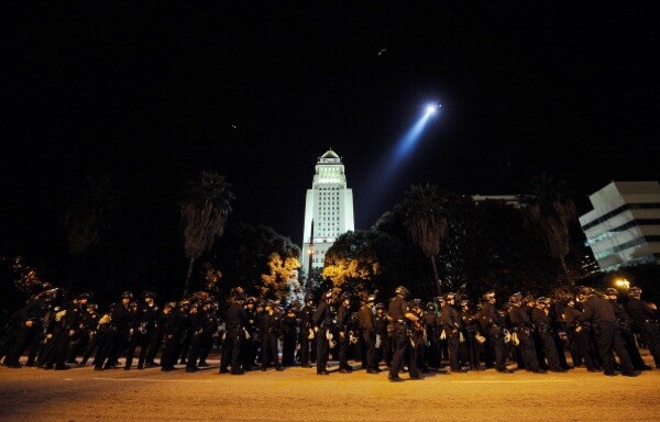 Hundreds of LAPD officers wait to walk into the Occupy Los Angeles protest encampment following the November 30, 2011 raid. | Photo by Kevork Djansezian/Getty Images)