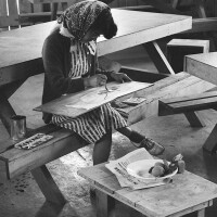 A student of Chiura Obata's art classes painting a free water color | Dorothea Lange, War Relocation Authority Photographs of Japanese-American Evacuation and Resettlement / National Archives ABs10 MMD