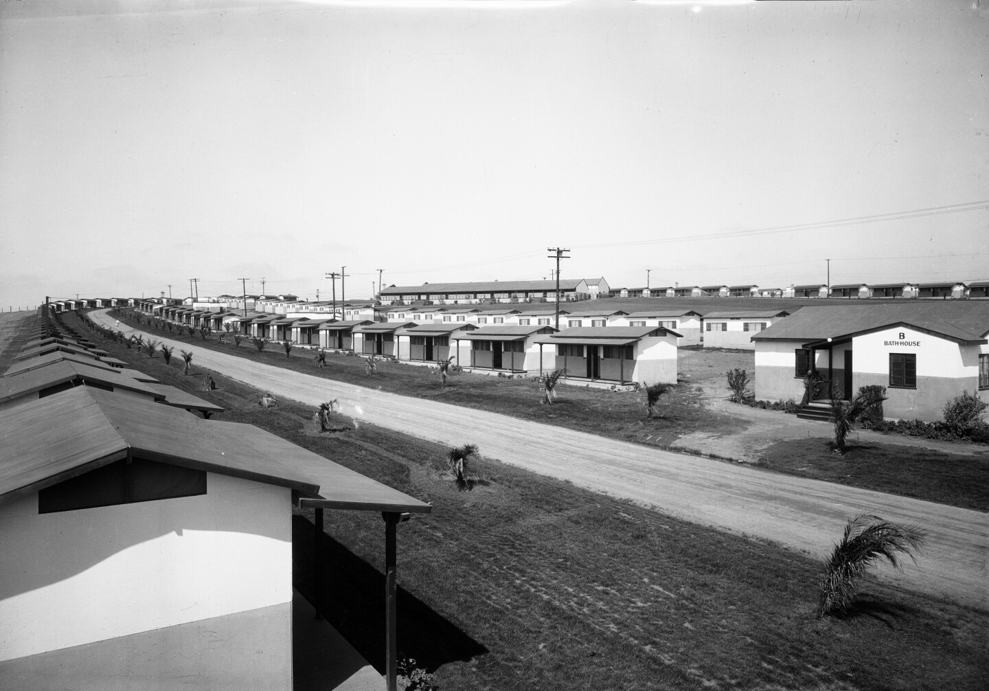 The neat rows of Olympic homes are seen on either side of the road.