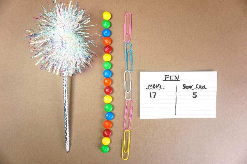 A sparkly pen’s length is measured in clips and M&M’s.