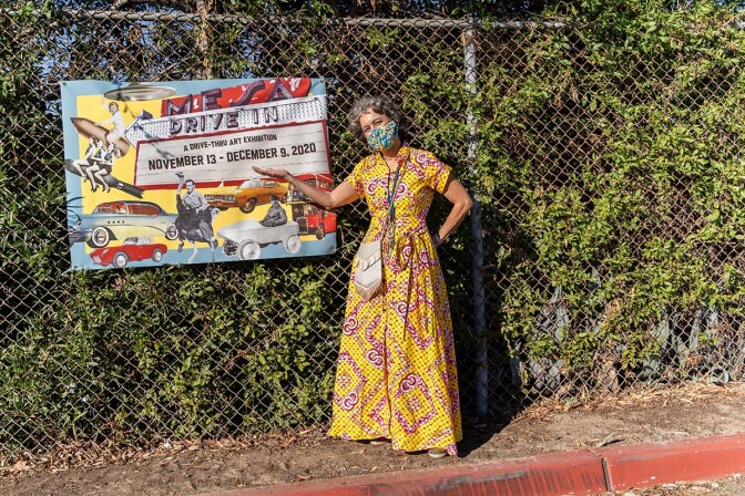 Alessandra Moctezuma, director of the Mesa College Art Gallery by the signs of the “Mesa College Drive-In: An Outdoor Art Exhibition" | San Diego Mesa College