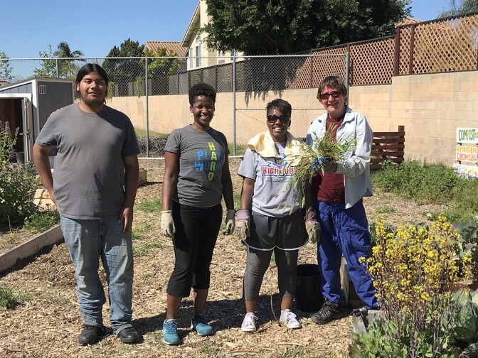 AHS student Oscar with USGBC-LA project lead Maya Henderson and volunteers | Marianne Zaugg