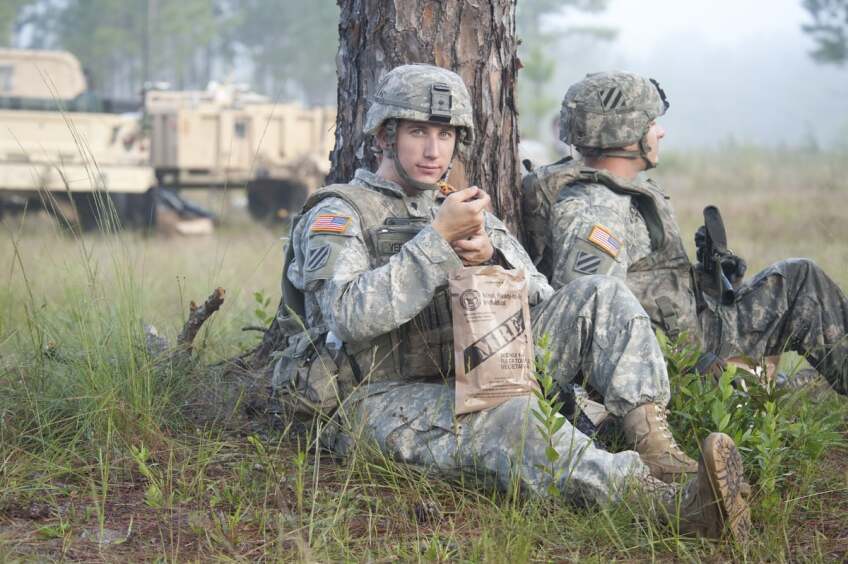 A still of soldier eating a Meals Ready to Eat (MRE) ration