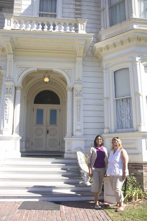 Jessica Rivas and Dana Anderson by the Perry Mansion, the largest home in the museum's collection.
