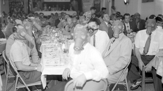 Highland Park Optimist Club wearing smog-gas masks at banquet in 1954 | L.A. Times photographic archive/UCLA Library