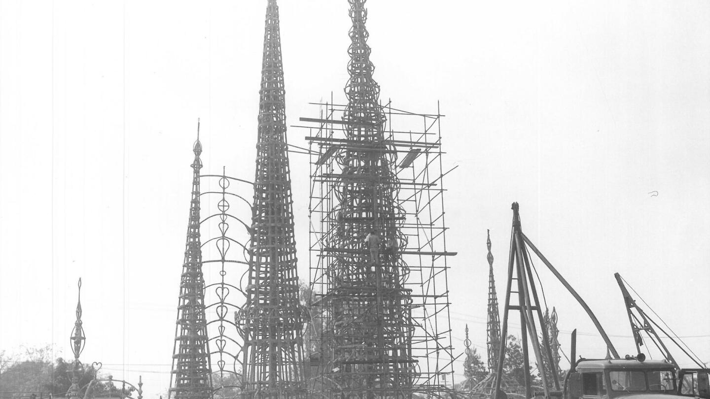 A crowd watches structural testing of the Watts Towers, July 1959