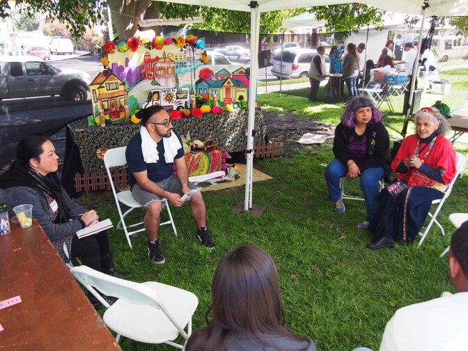 Ofelia Esparza (right) and Rosanna Esparza Ahrens (second from right) lead a group discussion at SaludArte, a community event in Boyle Heights that centered local cultural assets as tools for social change. | Photo courtesy of ACTA