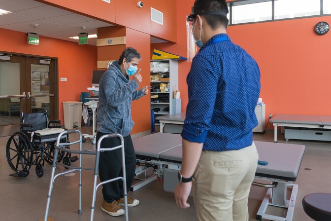 Perez dances to cumbia music as part of his physical therapy.