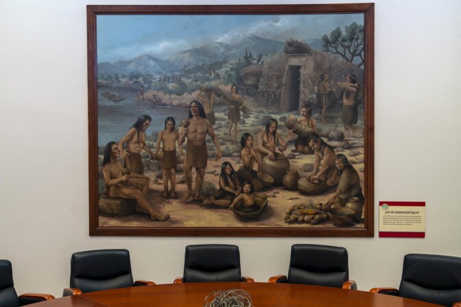 A painting representing Chemehuevi Valley village life in the conference room of the Chemehuevi Cultural Center, Havasu Lake, CA. Photo: Kim Stringfellow.