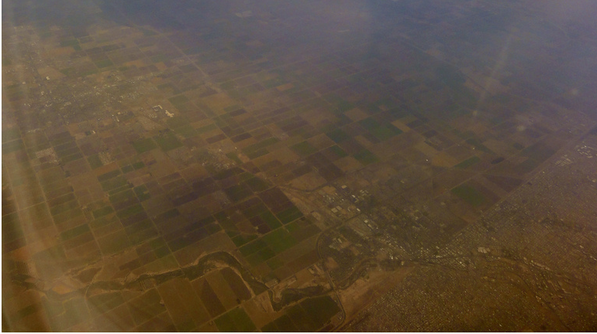 Aerial view of, or through, Calexico and Mexicali's air pollution | Creative Commons photo by Omar Barcena