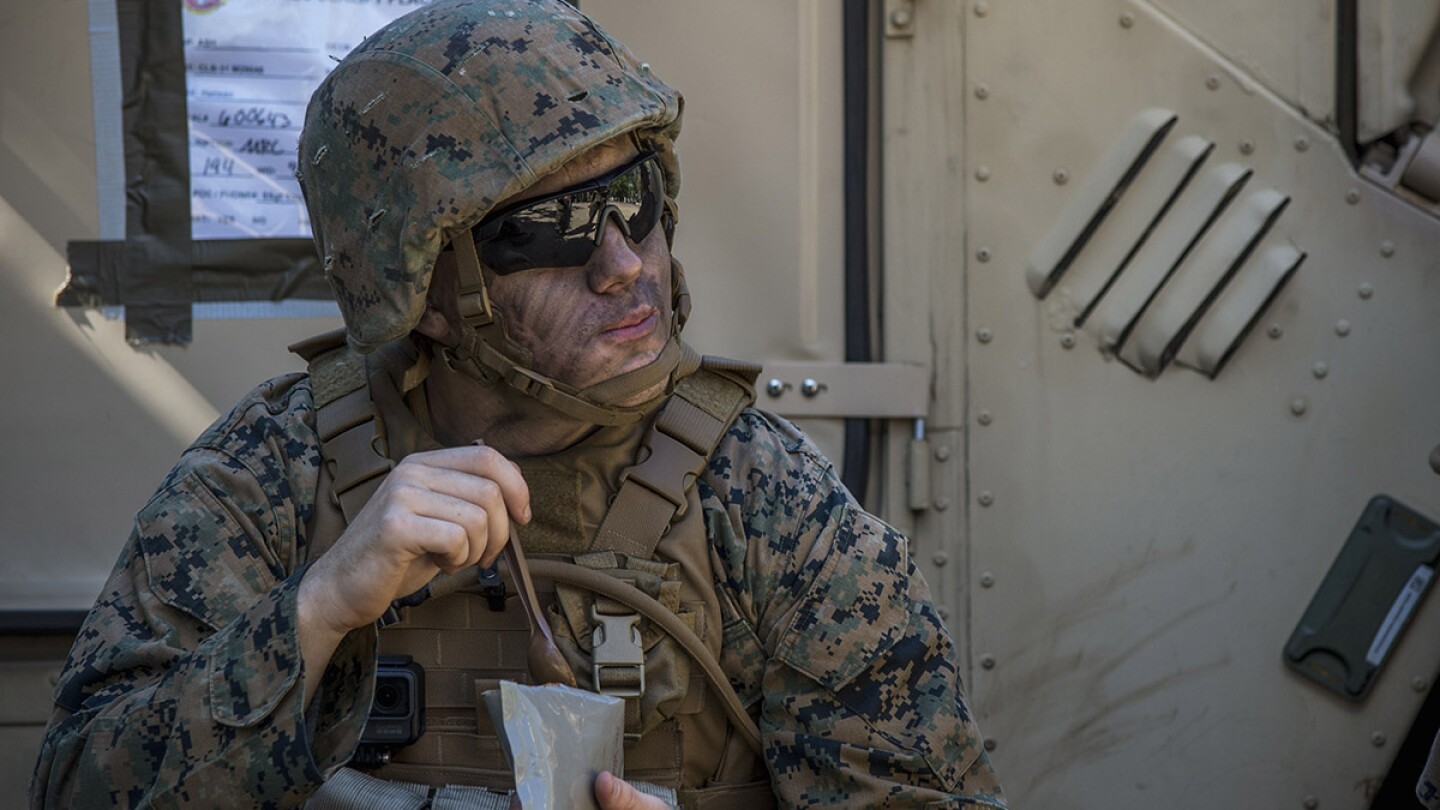 Lance Cpl. Noel Boyland, from Caseyville, Ill. eats an MRE | U.S. Navy photo by Mass Communication Specialist 2nd Class Sarah Villegas/Released