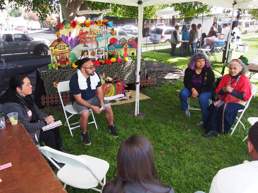 Ofelia Esparza (right) and Rosanna Esparza Ahrens (second from right) lead a group discussion at SaludArte, a community event in Boyle Heights that centered local cultural assets as tools for social change. | Photo courtesy of ACTA