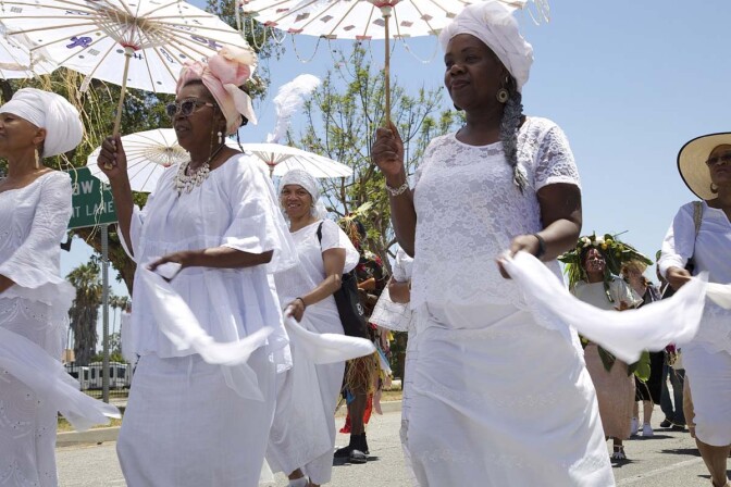 Women in white parade at the 2017 edition of the Day of the Ancestors: Festival of Masks. | Photo by Sahra Sulaiman, Courtesy of LA Commons