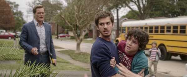 Michael Shannon, Andrew Garfield and Noah Lomax in 99 Homes