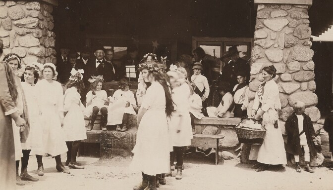 Girls gathered in front of hotel | Paul Kagan Utopian Communities Collection/Yale Beinecke Library