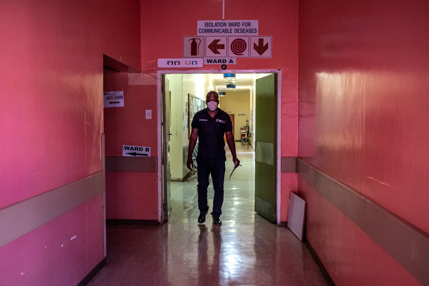 Specialist ICU Nurse Vicky Shikwambana, who is also the COVID-19 Ward Manager walks through the corridors of the Taung Hospital in Taung, the North West Province, South Africa, on Sept. 4, 2020. | Thomson Reuters Foundation/Gulshan Khan