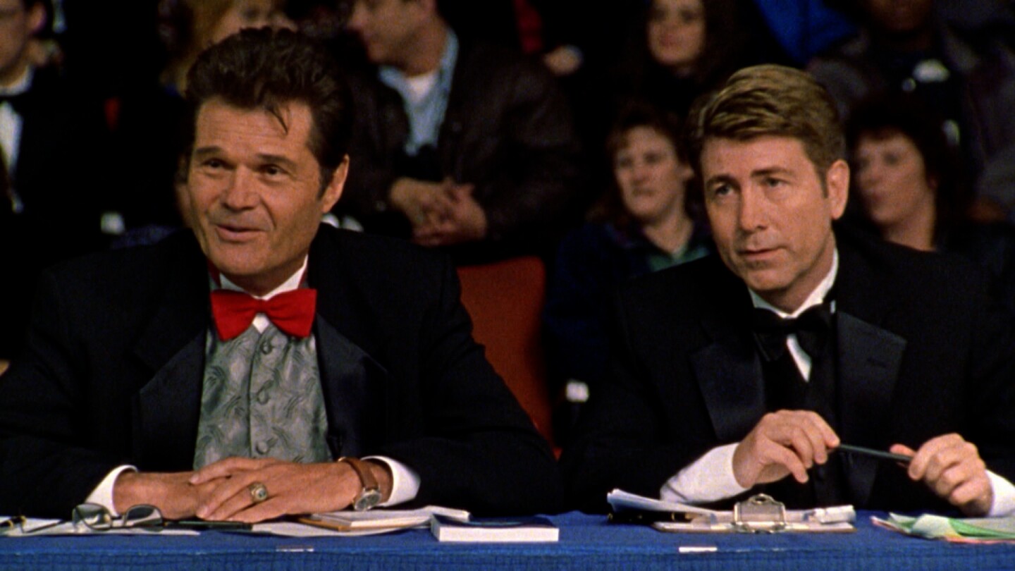 Two dog show judges in the film "Best In Show."