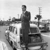 Congressman Richard M. Nixon delivers a stump speech from the back of his "Yellow Woody" Mercury Station Wagon during his successful 1950 U.S. Senate campaign, Garden Grove, April 28, 1950.
