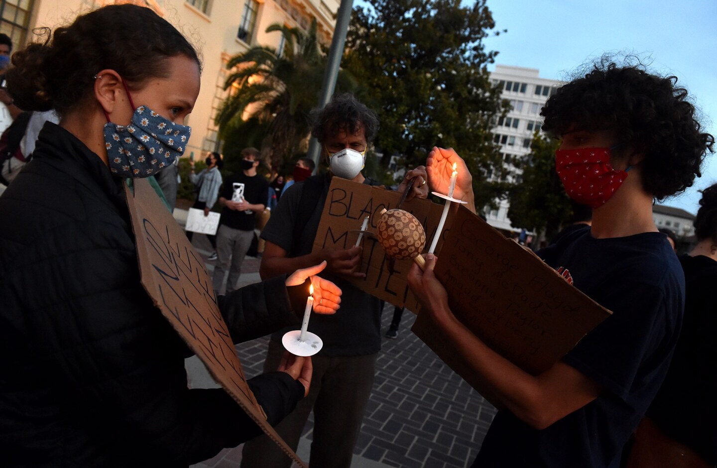 Protesters light candles during a candlelight vigil in front of Pasadena City Hall after the death of George Floyd, a black man who was in police custody in Minneapolis in Pasadena on Sunday, May 31, 2020. | (Photo by Keith Birmingham/MediaNews Group/Pasa
