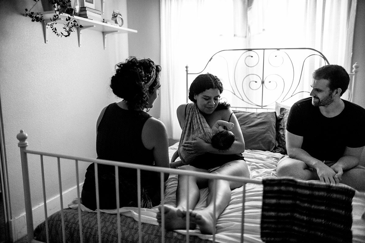 Panquetzani sits with new parents and their baby. | Samanta Helou Hernandez