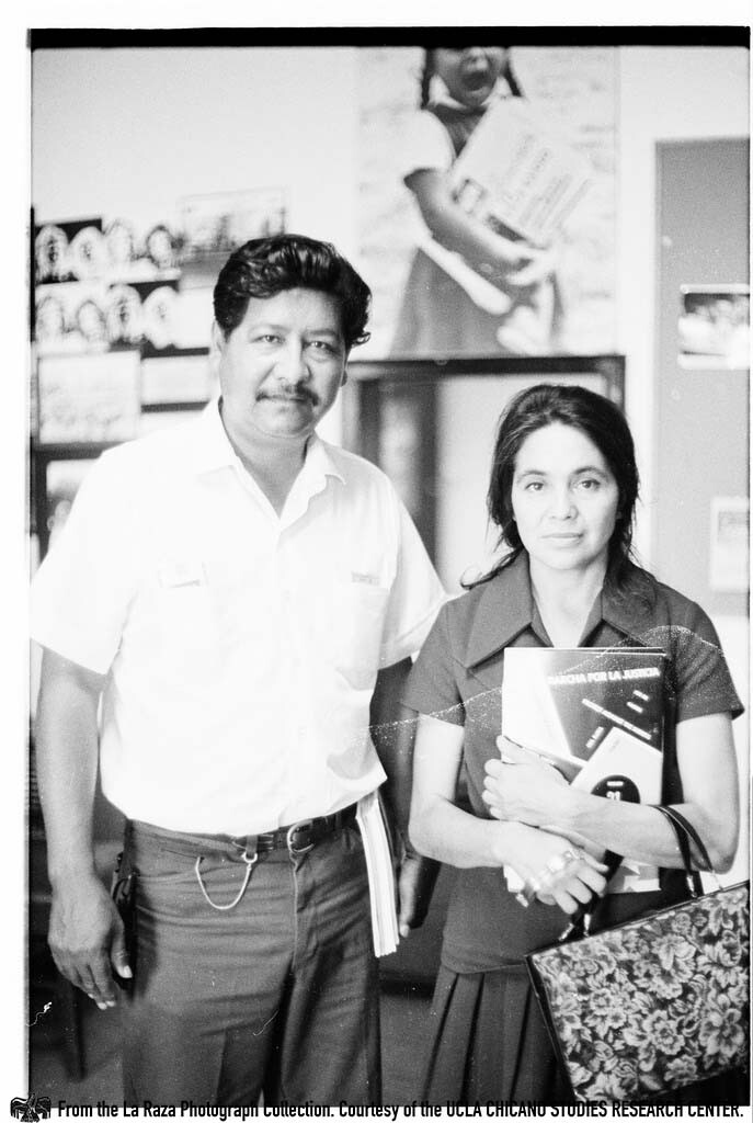 CSRC_LaRaza_B11F11C1_Staff_026 Dolores Huerta holding a copy of La Raza at the La Raza office | La Raza photograph collection. Courtesy of UCLA Chicano Studies Research Center