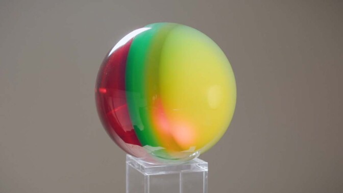 A multi-colored sphere by Helen Pashgian. | Still from Artbound "Light & Space" ab s11