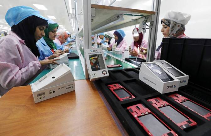 ARCHIVE PHOTO: Women work on a production line at the mobile phone factory in Assuit, Egypt September 30, 2018. | REUTERS/Mohamed Abd El Ghany