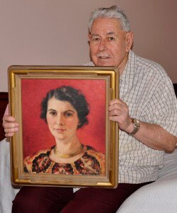 Robert Hillery holding Agnes Pelton's painting of his mother, Marguerite. | Photo by Christy Porter.