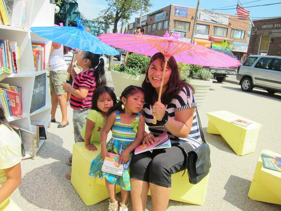 QMA collaborates with the Uni Project to bring a mobile reading room to the newly pedestrianized Corona Plaza, August 2012. Photo | Courtesy of the Queens Museum of Art.