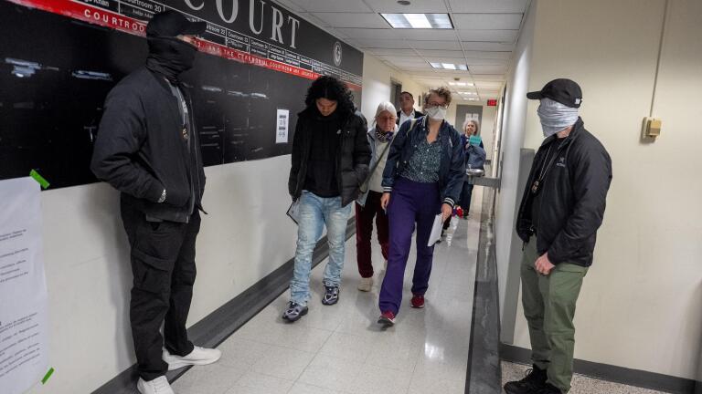 ICE agents arresting migrants at mandatory court check-ins