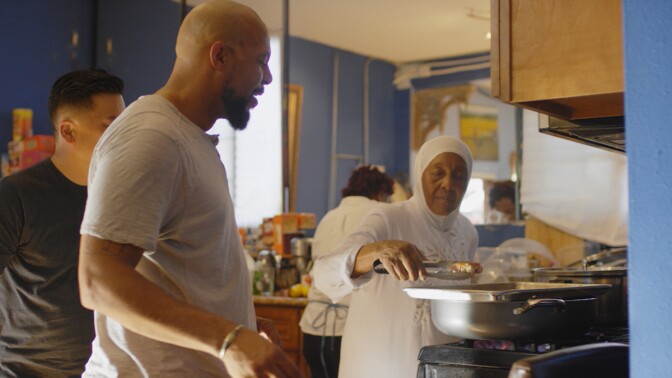 Aqeela Sherrills cooking with his mother, "Mama" Wajeha Bilal, who is also very active in the community. | Still from "Broken Bread" Watts