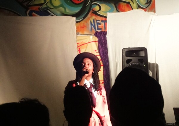 A young artist takes the stage at Bananas, an all ages event held every third Tuesday of the month at KAOS Network. Photo: Nathalia Morales-Evanks