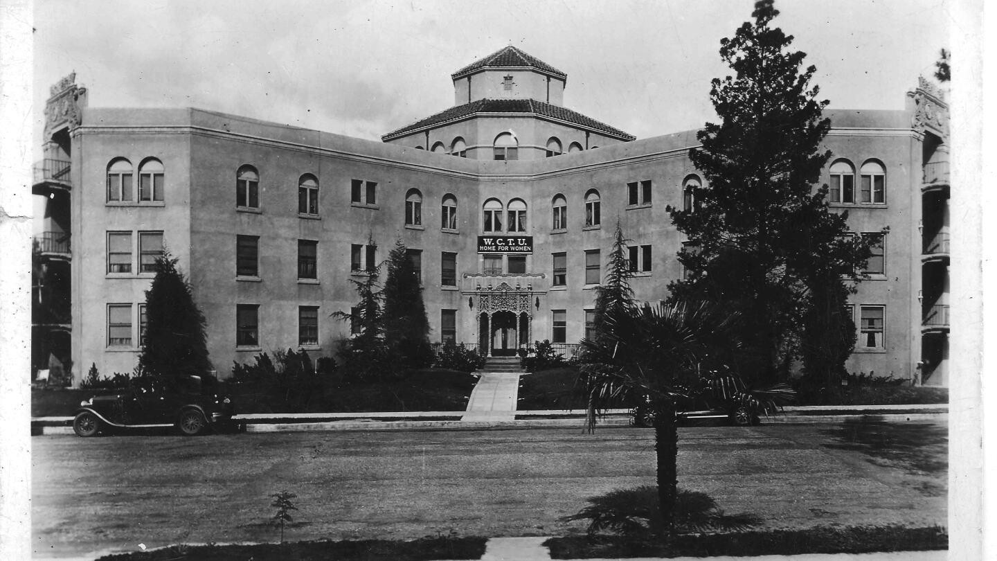 A black and white postcard photo of the Woman's Christian Temperance Union Home in Eagle Rock probably taken a few years after the home opened in 1928. The four-story main building is in the shape of a Maltese cross with Churrigueresque ornamentation over the main door, an the elevator in the center and four wings reaching out.