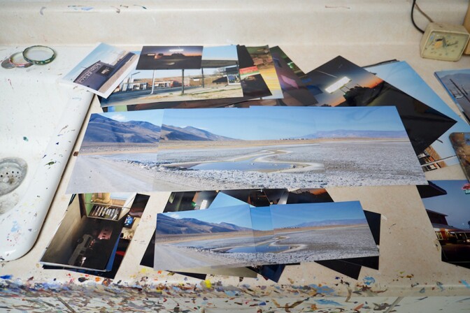 Photographic views of the Owens Dry Lakebed , Lone Pine California, spread out as Patricia Chidlaw creates her composition for a painting. | Photo: Osceola Refetoff