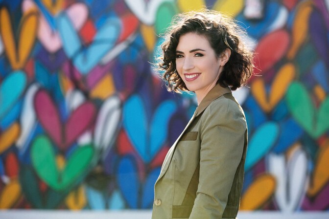 Jennifer Rosenfeld poses in front of a colorful wall. | Courtesy of Jennifer Rosenfeld
