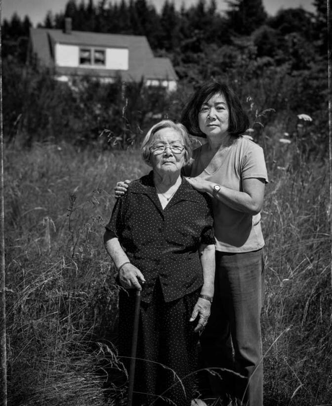 Fumiko Hayashida, 95, and her daughter Natalie Ong, 66, on the family farm where they lived before their forced removal from Bainbridge Island in 1942.| Paul Kitakagi, Jr.